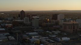 5.7K aerial stock footage of slowly flying away from high-rise office buildings at sunset, Downtown Albuquerque, New Mexico Aerial Stock Footage | DX0002_122_037