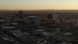 5.7K aerial stock footage of slowly approaching high-rise office buildings at sunset, Downtown Albuquerque, New Mexico Aerial Stock Footage | DX0002_122_038