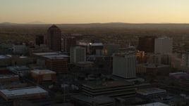 5.7K aerial stock footage of slowly flying toward high-rise office buildings at sunset, Downtown Albuquerque, New Mexico Aerial Stock Footage | DX0002_122_039