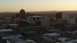 5.7K aerial stock footage approach and then flyby office high-rises at sunset, Downtown Albuquerque, New Mexico Aerial Stock Footage | DX0002_122_045