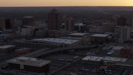 5.7K aerial stock footage orbit office tower and shorter hotel tower behind convention center at sunset, Downtown Albuquerque, New Mexico Aerial Stock Footage | DX0002_122_051