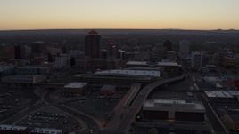 5.7K aerial stock footage approach and pass Albuquerque Plaza and Hyatt Regency at sunset near office high-rises, Downtown Albuquerque, New Mexico Aerial Stock Footage | DX0002_123_007