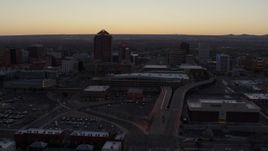 5.7K aerial stock footage flyby Albuquerque Plaza and Hyatt Regency at sunset near office high-rises, Downtown Albuquerque, New Mexico Aerial Stock Footage | DX0002_123_008