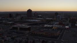 5.7K aerial stock footage passing Albuquerque Plaza and Hyatt Regency at sunset near office high-rises, Downtown Albuquerque, New Mexico Aerial Stock Footage | DX0002_123_009