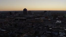 5.7K aerial stock footage approach Albuquerque Plaza and Hyatt Regency at sunset, Downtown Albuquerque, New Mexico Aerial Stock Footage | DX0002_123_011