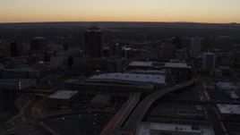 5.7K aerial stock footage flyby and way from Albuquerque Plaza and Hyatt Regency at sunset, Downtown Albuquerque, New Mexico Aerial Stock Footage | DX0002_123_012