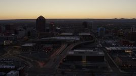 5.7K aerial stock footage flying by Albuquerque Plaza, Hyatt Regency and city high-rises at sunset, Downtown Albuquerque, New Mexico Aerial Stock Footage | DX0002_123_016
