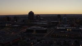 5.7K aerial stock footage of a wide orbit of Albuquerque Plaza, Hyatt Regency and city high-rises at sunset, Downtown Albuquerque, New Mexico Aerial Stock Footage | DX0002_123_017