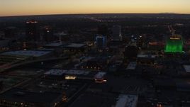 5.7K aerial stock footage flyby hotel and nearby office buildings at twilight, Downtown Albuquerque, New Mexico Aerial Stock Footage | DX0002_123_025