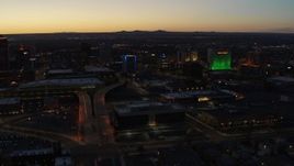 5.7K aerial stock footage DoubleTree hotel with blue lighting near office buildings at twilight, Downtown Albuquerque, New Mexico Aerial Stock Footage | DX0002_123_028