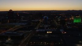 5.7K aerial stock footage fly past hotel with blue lighting near office towers at twilight, Downtown Albuquerque, New Mexico Aerial Stock Footage | DX0002_123_033