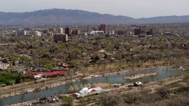 5.7K aerial stock footage flying by high-rise office buildings, descend by park, Downtown Albuquerque, New Mexico Aerial Stock Footage | DX0002_124_007
