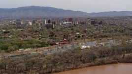 5.7K aerial stock footage of high-rise office buildings seen from city park, Downtown Albuquerque, New Mexico Aerial Stock Footage | DX0002_124_009