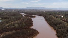 5.7K aerial stock footage of flying over the Rio Grande, approach small islands in the river in Albuquerque, New Mexico Aerial Stock Footage | DX0002_124_012