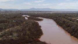 5.7K aerial stock footage of flying away from islands in the Rio Grande river in Albuquerque, New Mexico Aerial Stock Footage | DX0002_124_013