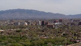 5.7K aerial stock footage descend with wide view of high-rise office buildings, distant mountains, Downtown Albuquerque, New Mexico Aerial Stock Footage | DX0002_124_019