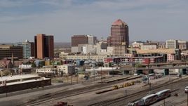 5.7K aerial stock footage of an office high-rise seen from train tracks, Downtown Albuquerque, New Mexico Aerial Stock Footage | DX0002_124_020