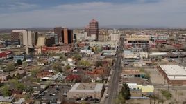5.7K aerial stock footage flyby and away from Albuquerque Plaza and surrounding buildings, Downtown Albuquerque, New Mexico Aerial Stock Footage | DX0002_124_031