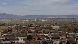 5.7K aerial stock footage flyby suburban homes with a view of Downtown Albuquerque in the distance, New Mexico Aerial Stock Footage | DX0002_126_003