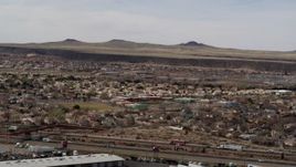 5.7K aerial stock footage of suburban neighborhood and elementary school across freeway in Albuquerque, New Mexico Aerial Stock Footage | DX0002_126_014