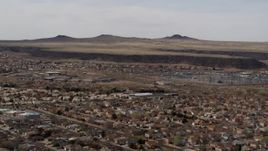 5.7K aerial stock footage of passing by a suburban neighborhood, Albuquerque, New Mexico Aerial Stock Footage | DX0002_126_017