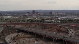 5.7K aerial stock footage of Downtown Albuquerque seen from a freeway interchange, New Mexico Aerial Stock Footage | DX0002_126_020
