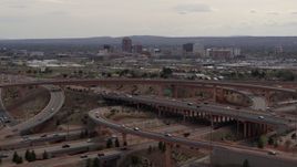 5.7K aerial stock footage of Downtown Albuquerque seen while passing freeway interchange traffic, New Mexico Aerial Stock Footage | DX0002_126_023