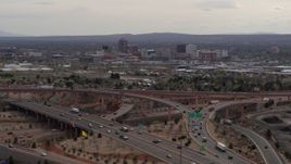5.7K aerial stock footage of Downtown Albuquerque seen from freeway interchange traffic, New Mexico Aerial Stock Footage | DX0002_126_025