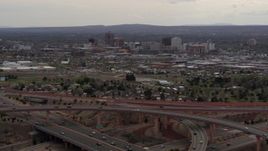 5.7K aerial stock footage of Downtown Albuquerque high-rises seen from freeway interchange, New Mexico Aerial Stock Footage | DX0002_126_034