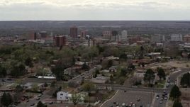 5.7K aerial stock footage wide view of city's high-rises seen while slowly passing homes, Downtown Albuquerque, New Mexico Aerial Stock Footage | DX0002_126_044