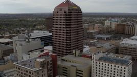 5.7K aerial stock footage flying away from Albuquerque Plaza and neighboring city buildings, Downtown Albuquerque, New Mexico Aerial Stock Footage | DX0002_127_005