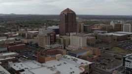 5.7K aerial stock footage wide orbit of Albuquerque Plaza high-rise and neighboring city buildings, Downtown Albuquerque, New Mexico Aerial Stock Footage | DX0002_127_008