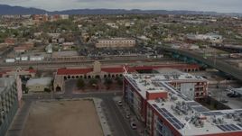 5.7K aerial stock footage orbit and stationary view of the entrance of the Albuquerque train station, Downtown Albuquerque, New Mexico Aerial Stock Footage | DX0002_127_023