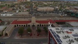 5.7K aerial stock footage approach the entrance of the Albuquerque train station, Downtown Albuquerque, New Mexico Aerial Stock Footage | DX0002_127_024