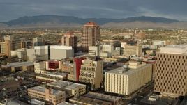 5.7K aerial stock footage fly away from Albuquerque Plaza towering over city buildings, Downtown Albuquerque, New Mexico Aerial Stock Footage | DX0002_127_027