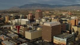 5.7K aerial stock footage flyby federal building, focus on Albuquerque Plaza high-rise, Downtown Albuquerque, New Mexico Aerial Stock Footage | DX0002_127_033