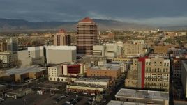5.7K aerial stock footage descend and orbit office high-rise and city buildings, Downtown Albuquerque, New Mexico Aerial Stock Footage | DX0002_127_035