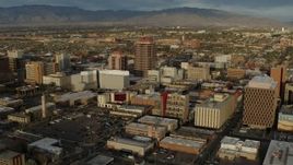 5.7K aerial stock footage a reverse view of office high-rise and city buildings, Downtown Albuquerque, New Mexico Aerial Stock Footage | DX0002_127_036