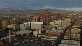 5.7K aerial stock footage a reverse view of office high-rise at the center of city buildings, Downtown Albuquerque, New Mexico Aerial Stock Footage | DX0002_127_045