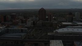 5.7K aerial stock footage of orbiting office high-rise beside hotel at sunset, Downtown Albuquerque, New Mexico Aerial Stock Footage | DX0002_128_003