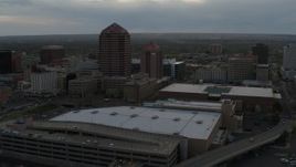 5.7K aerial stock footage orbit office high-rise and hotel by convention center at sunset, Downtown Albuquerque, New Mexico Aerial Stock Footage | DX0002_128_004