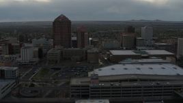5.7K aerial stock footage orbit around office high-rise, hotel, convention center, Kiva Auditorium at sunset, Downtown Albuquerque, New Mexico Aerial Stock Footage | DX0002_128_005