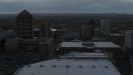 5.7K aerial stock footage orbiting the office high-rise, hotel, Kiva Auditorium at sunset, Downtown Albuquerque, New Mexico Aerial Stock Footage | DX0002_128_008