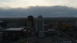 5.7K aerial stock footage flyby Kiva Auditorium to approach hotel at sunset, Downtown Albuquerque, New Mexico Aerial Stock Footage | DX0002_128_012