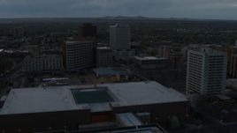 5.7K aerial stock footage flyby hotel, office buildings, Kiva Auditorium at sunset, Downtown Albuquerque, New Mexico Aerial Stock Footage | DX0002_128_013