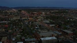 5.7K aerial stock footage of a view of a hospital from downtown at twilight, Albuquerque, New Mexico Aerial Stock Footage | DX0002_128_015