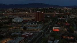 5.7K aerial stock footage orbit around medical center at twilight, then approach, Albuquerque, New Mexico Aerial Stock Footage | DX0002_128_018