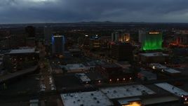 5.7K aerial stock footage approach office buildings near hotel at twilight, Downtown Albuquerque, New Mexico Aerial Stock Footage | DX0002_128_019