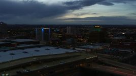 5.7K aerial stock footage fly over convention center to approach hotel and office buildings at twilight, Downtown Albuquerque, New Mexico Aerial Stock Footage | DX0002_128_022