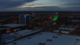 5.7K aerial stock footage approach and flyby hotel and office buildings at twilight, Downtown Albuquerque, New Mexico Aerial Stock Footage | DX0002_128_024